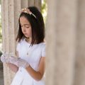 portrait child getting ready their first communion